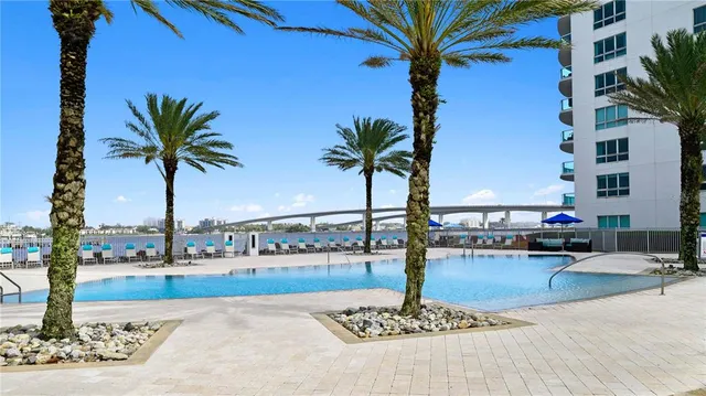 a view of a terrace with palm trees