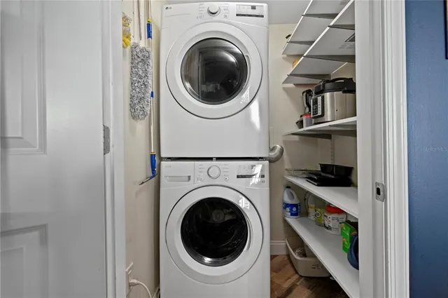 a view of a bedroom with washer and dryer