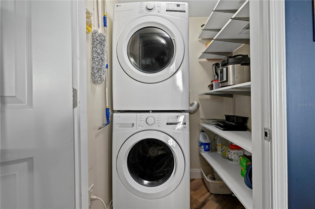 241 Riverside Drive, Unit 1909 Daytona Beach, FL 32117 - Photo 50 of 50 a view of a bedroom with washer and dryer