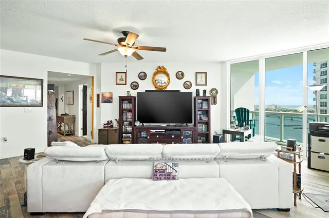 a living room with fireplace furniture and a flat screen tv