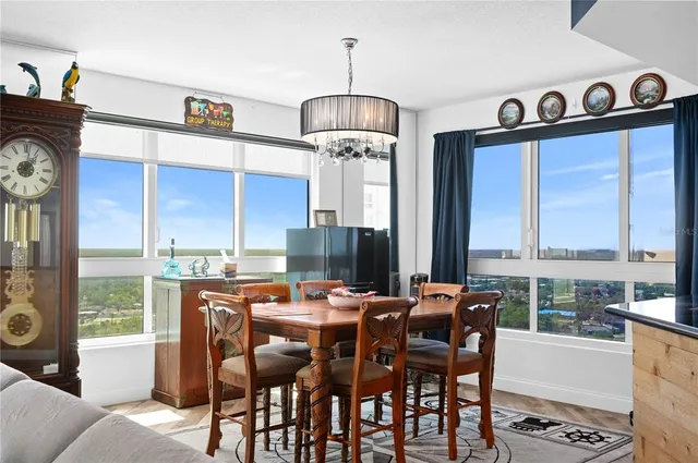 a view of a dining room with furniture window and outside view