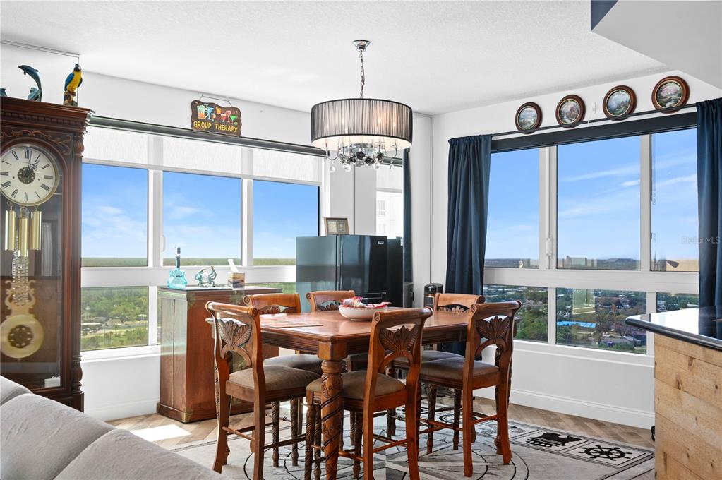 241 Riverside Drive, Unit 1909 Daytona Beach, FL 32117 - Photo 6 of 50 a view of a dining room with furniture window and outside view