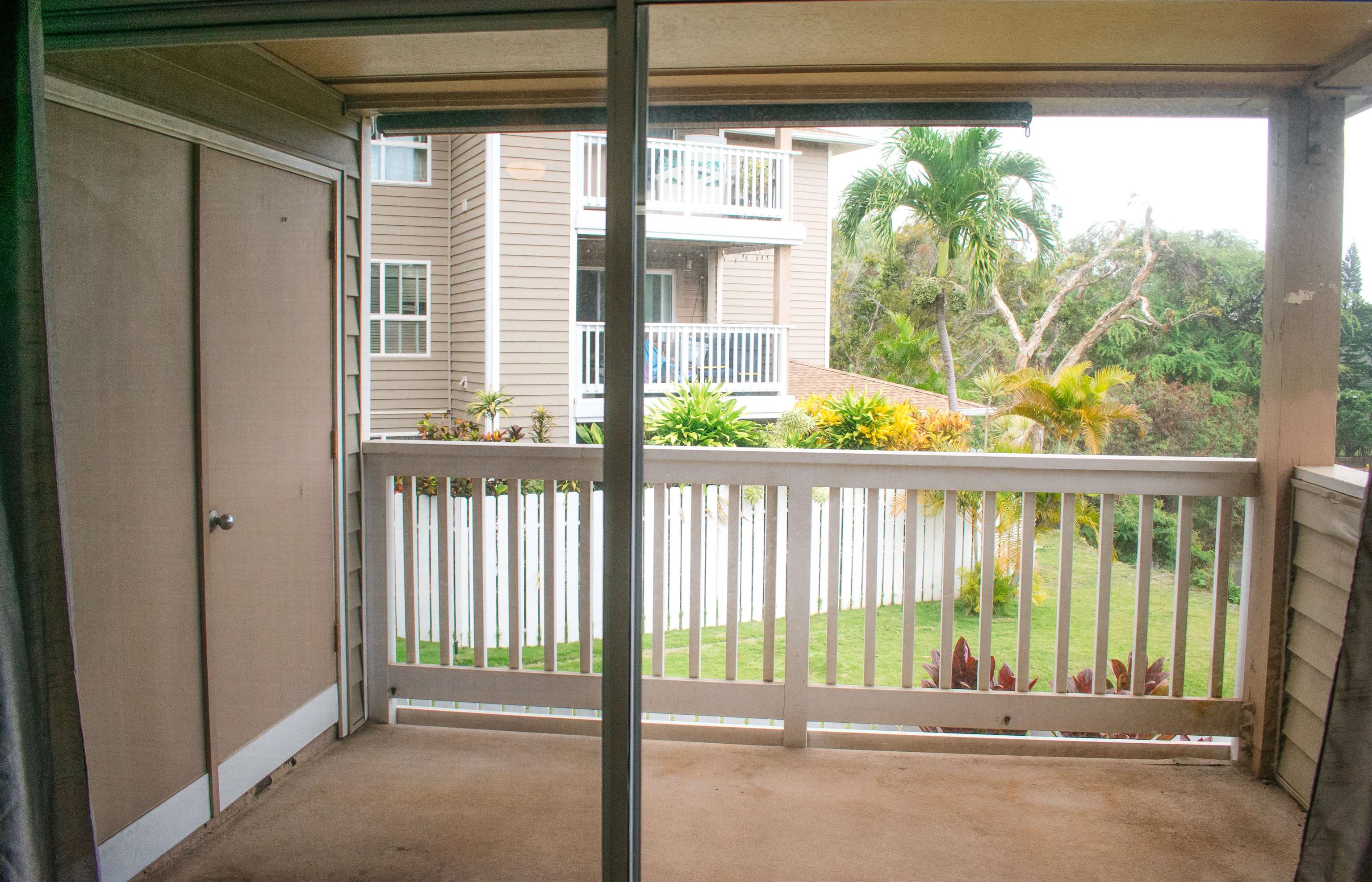 64 Kunihi Lane, Unit 324 Kahului, HI 96732 - Photo 12 of 31 a view of a porch with a floor to ceiling window