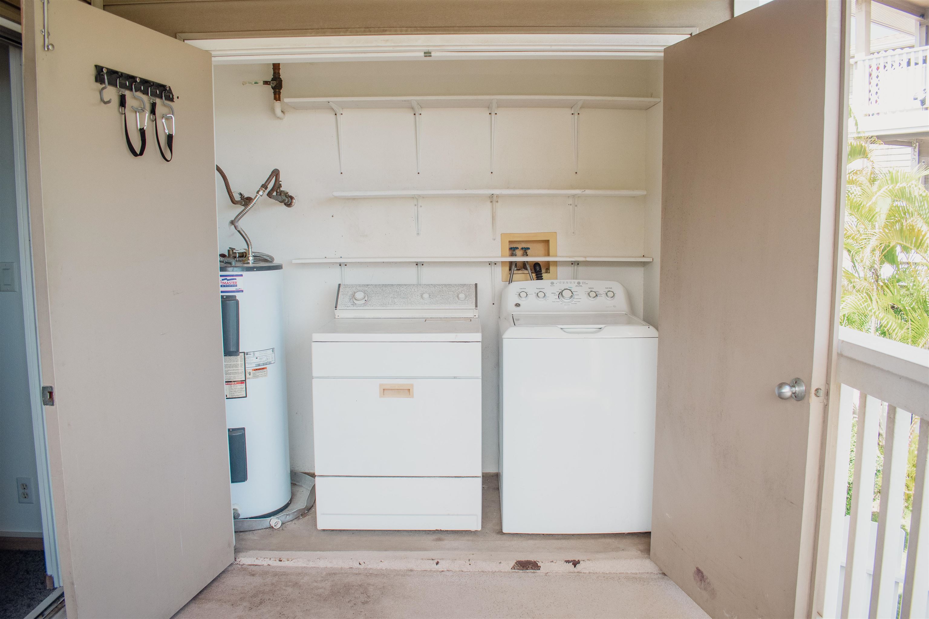 64 Kunihi Lane, Unit 324 Kahului, HI 96732 - Photo 13 of 31 a utility room with dryer and washer
