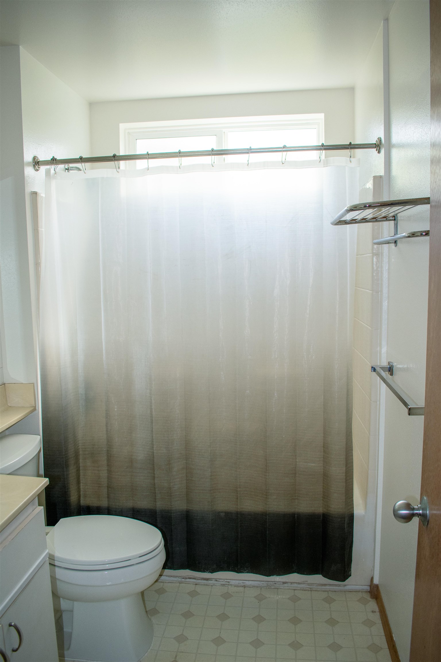 64 Kunihi Lane, Unit 324 Kahului, HI 96732 - Photo 20 of 31 a bathroom with a shower and a toilet