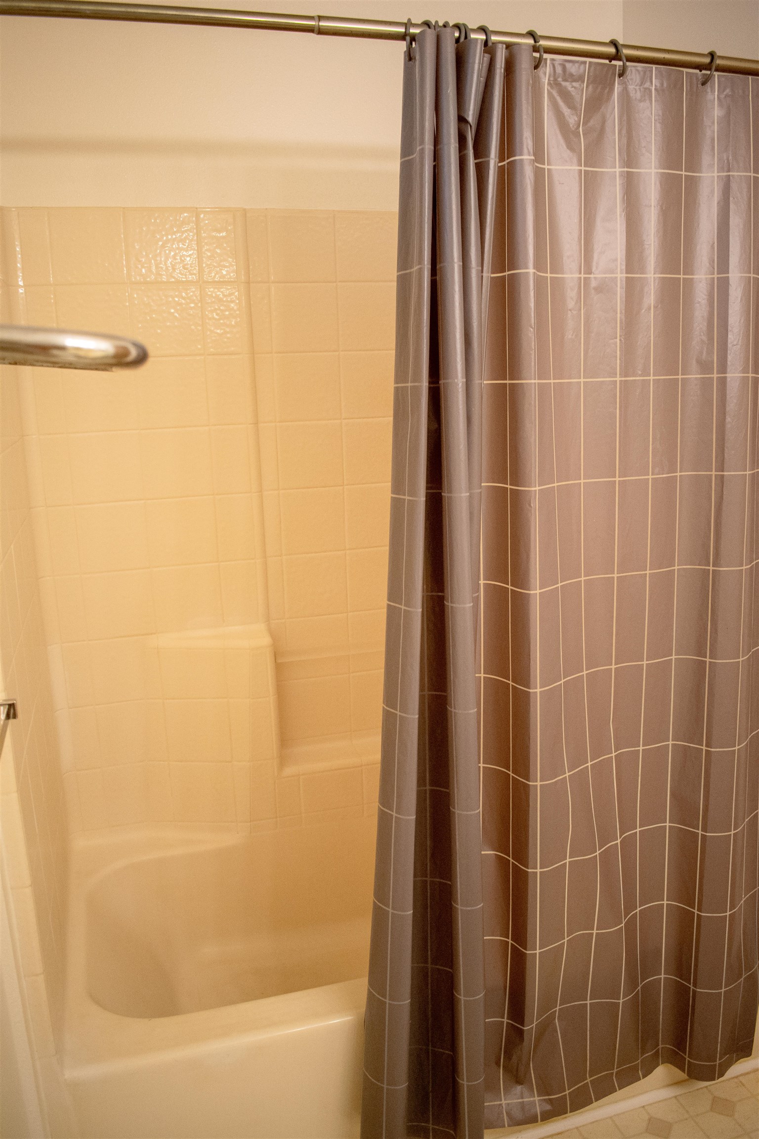 64 Kunihi Lane, Unit 324 Kahului, HI 96732 - Photo 30 of 31 a bathroom with a shower and a bathtub