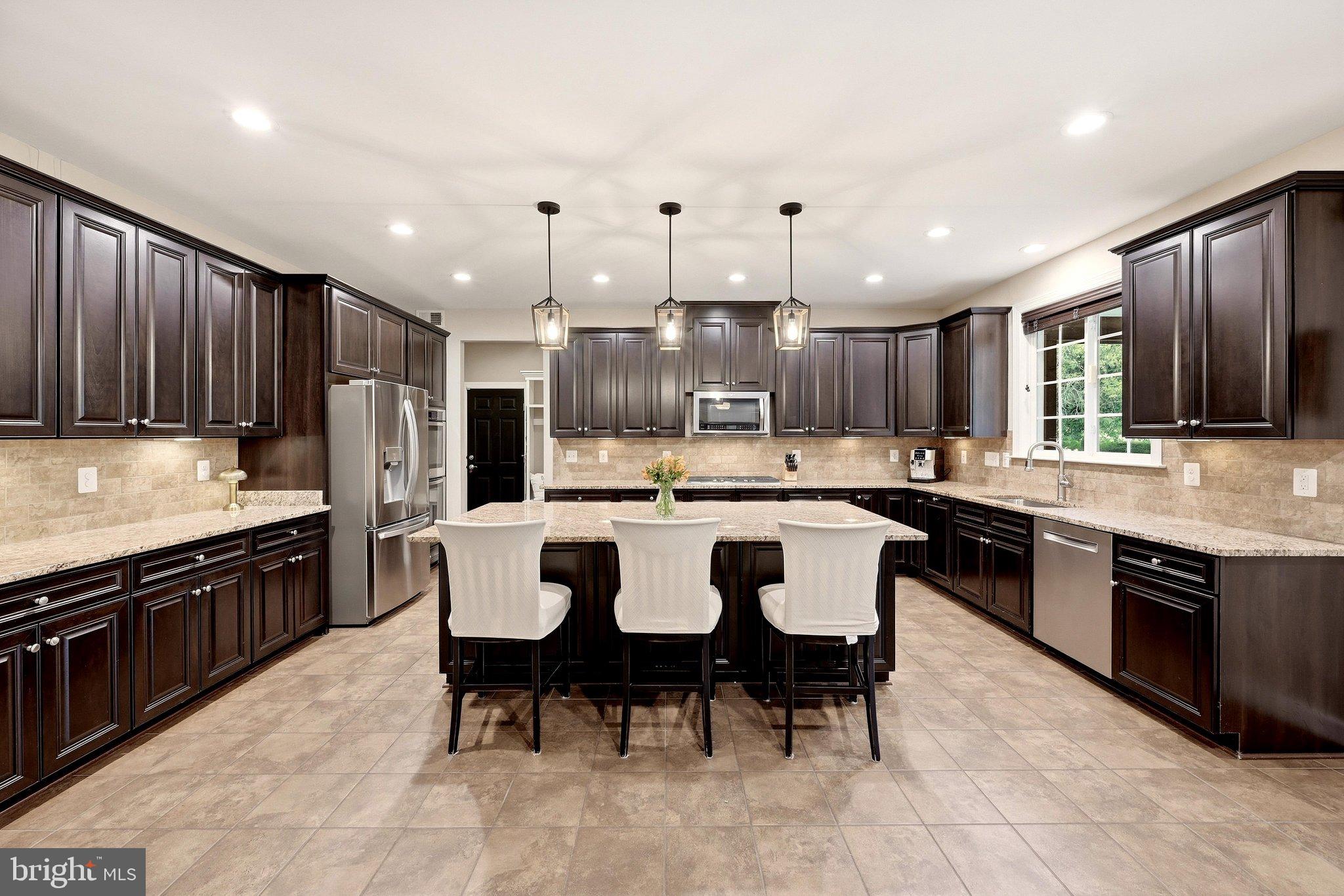 Gourmet kitchen with large granite island