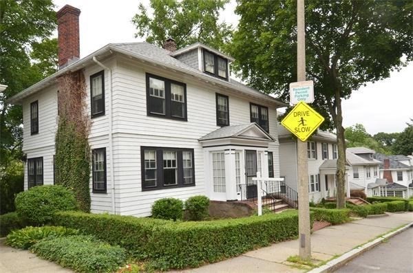120 Lake Street Boston, MA 02135 - Photo 2 of 28 a view of a white house with a yard in front of it