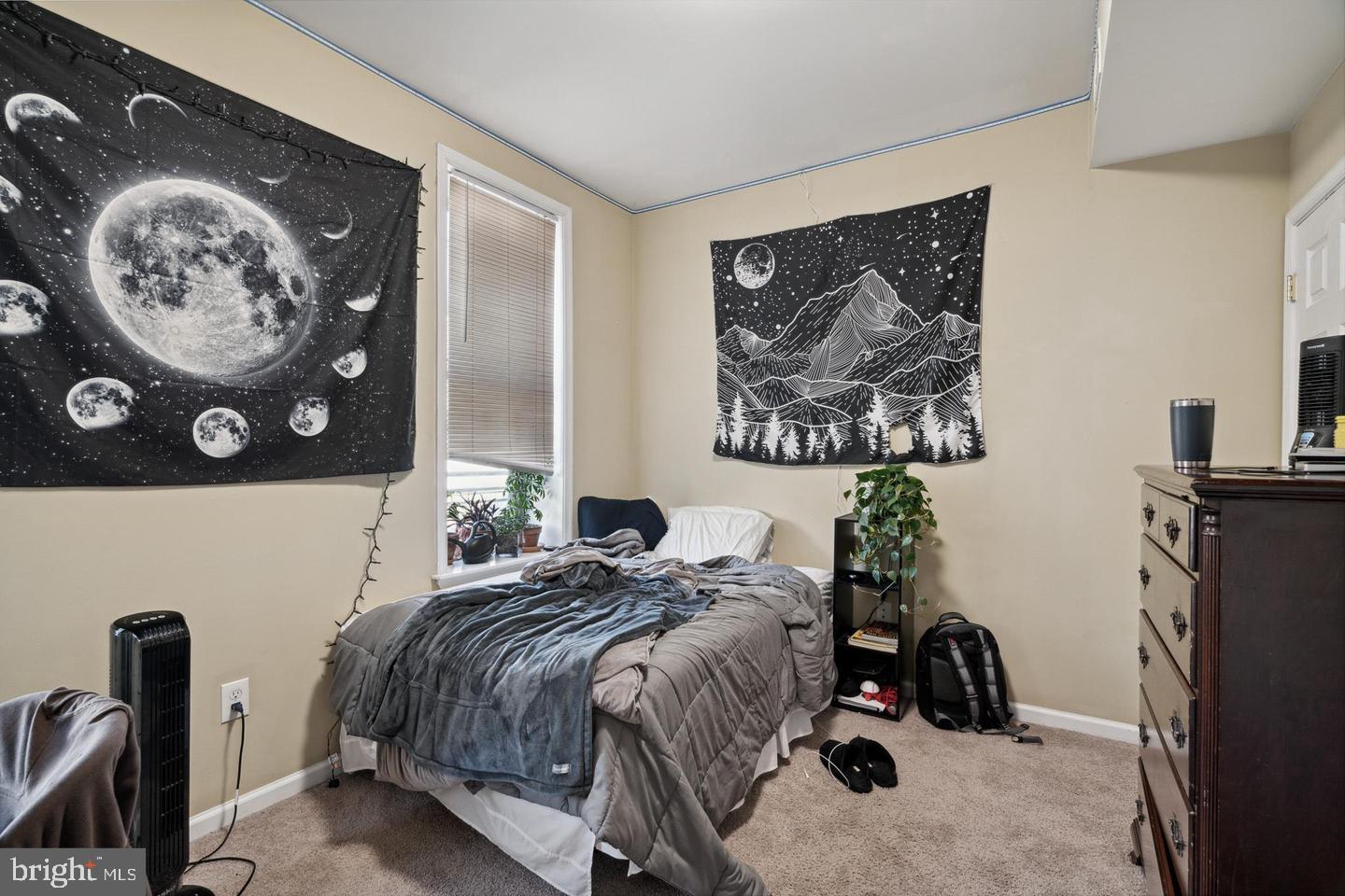 1611 North 17th Street, Unit B Philadelphia, PA 19121 - Photo 4 of 10 a bedroom with a bed and a painting on the wall