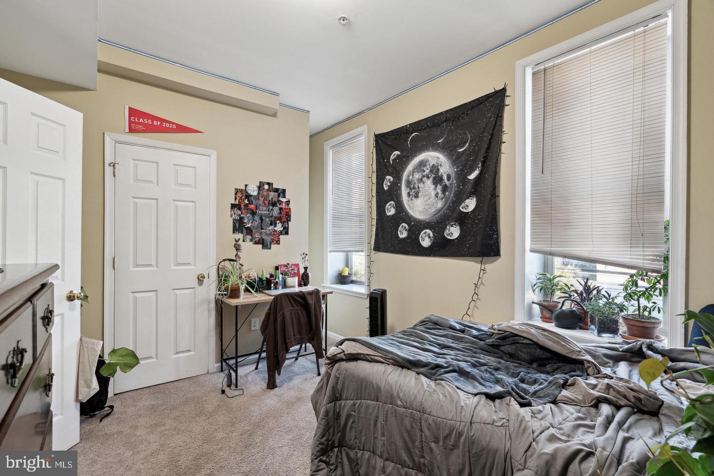 1611 North 17th Street, Unit B Philadelphia, PA 19121 - Photo 5 of 10 a bedroom with a bed and a painting on the wall