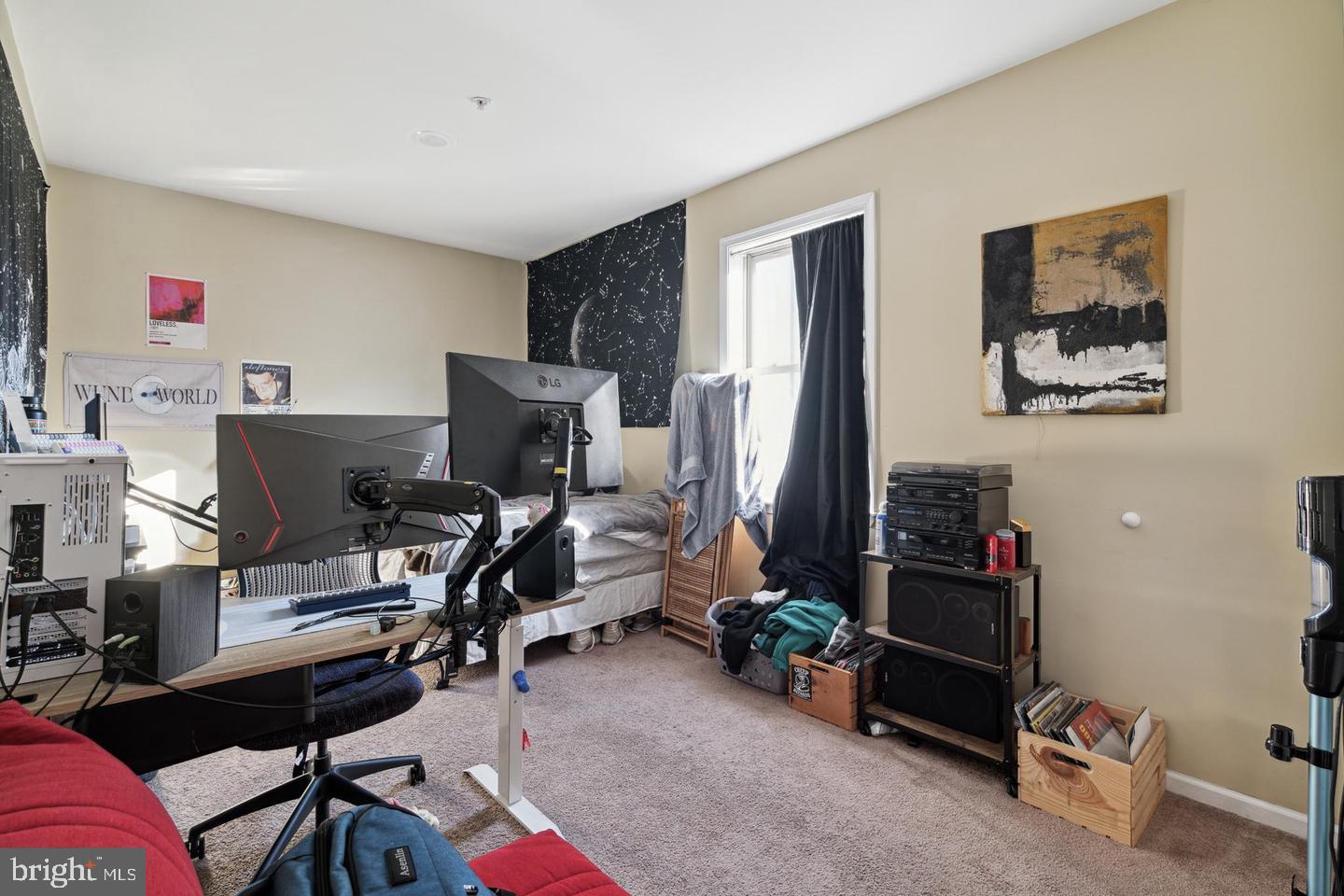 1611 North 17th Street, Unit B Philadelphia, PA 19121 - Photo 9 of 10 a view of a workspace with furniture and a window