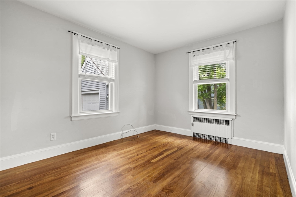 5 Walker Avenue Andover, MA 01810 - Photo 12 of 23 a view of an empty room with wooden floor and a window