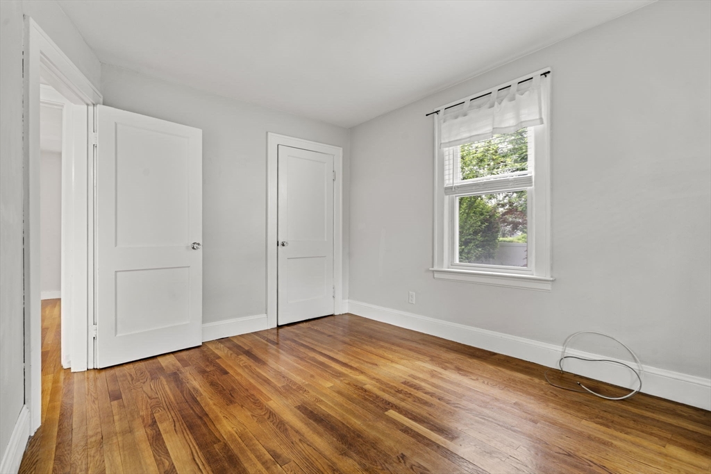 5 Walker Avenue Andover, MA 01810 - Photo 16 of 23 a view of empty room with wooden floor and fan