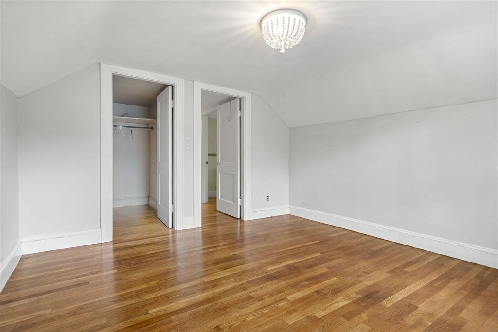 5 Walker Avenue Andover, MA 01810 - Photo 17 of 23 a view of an empty room with wooden floor and a window