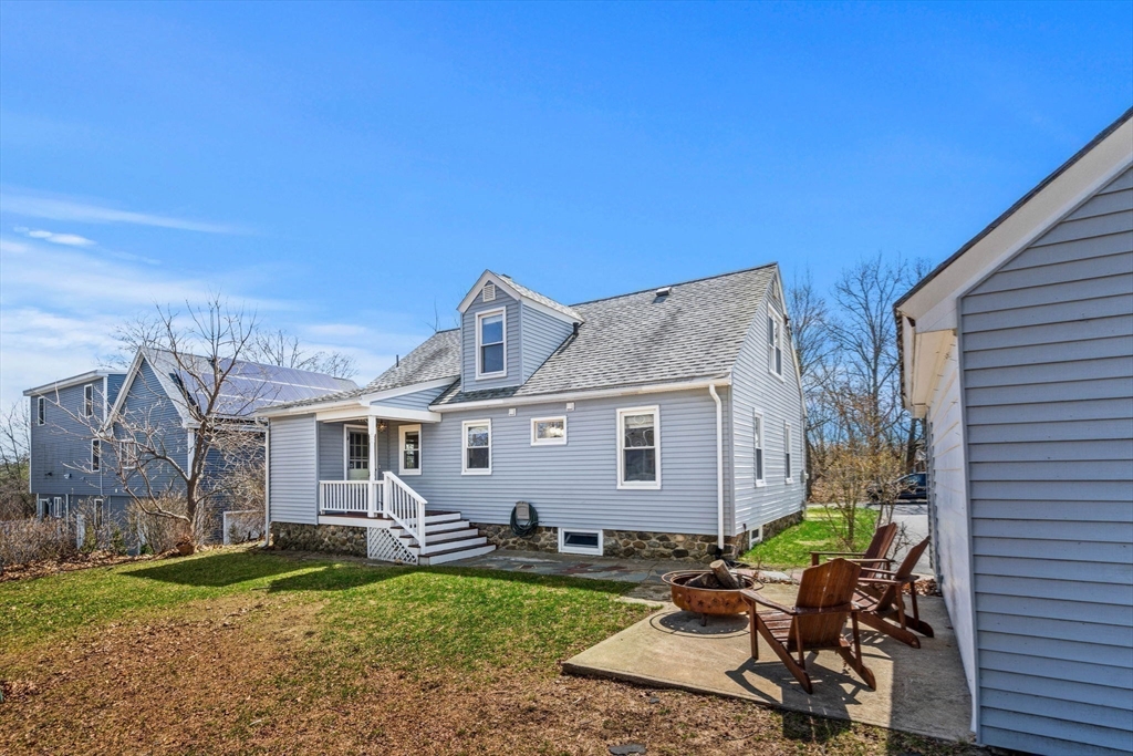 5 Walker Avenue Andover, MA 01810 - Photo 21 of 23 a view of a house with backyard sitting area and garden