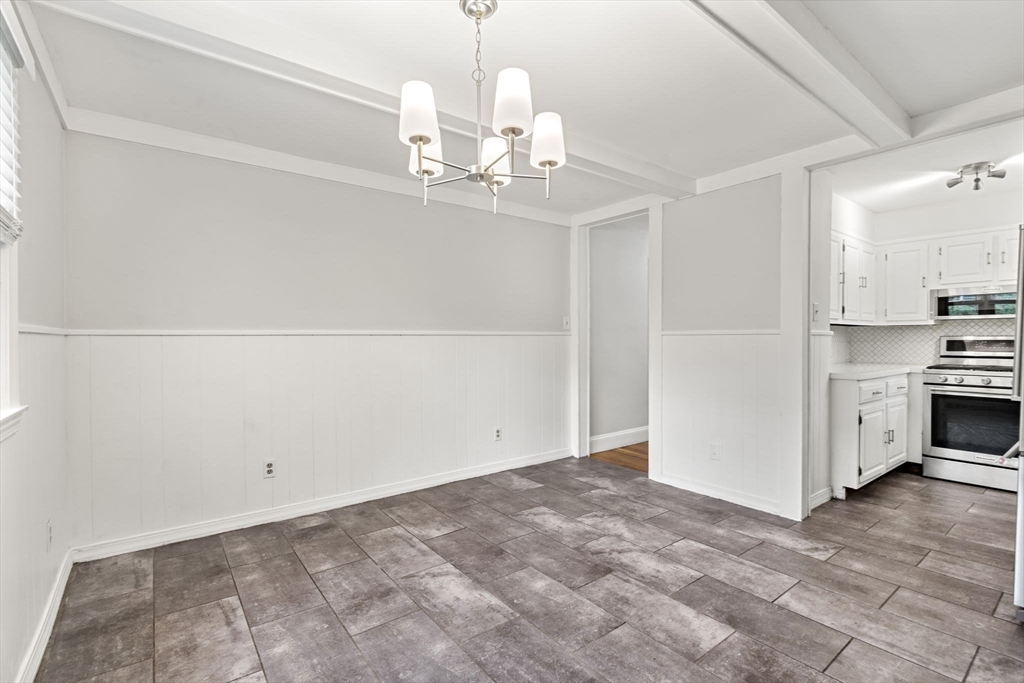 5 Walker Avenue Andover, MA 01810 - Photo 6 of 23 a view of a kitchen with stove and refrigerator