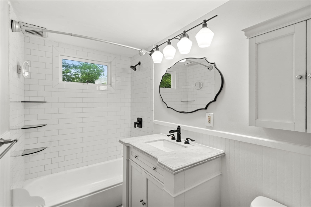 5 Walker Avenue Andover, MA 01810 - Photo 10 of 23 a bathroom with a sink mirror vanity and toilet