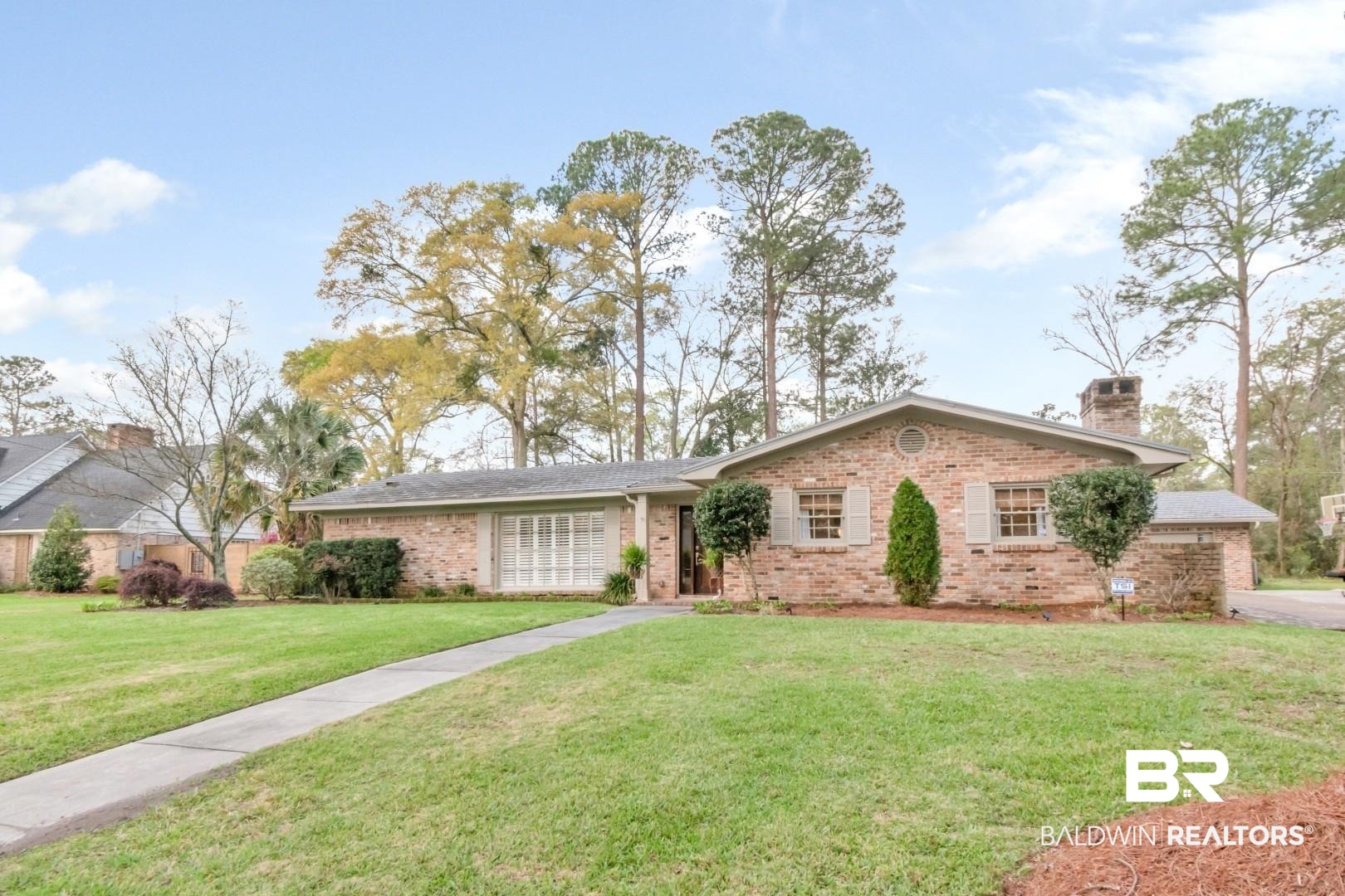 154 Fenwick Road Mobile, AL 36608 - Photo 45 of 48 Ranch-style house featuring brick siding, a front yard, and a chimney