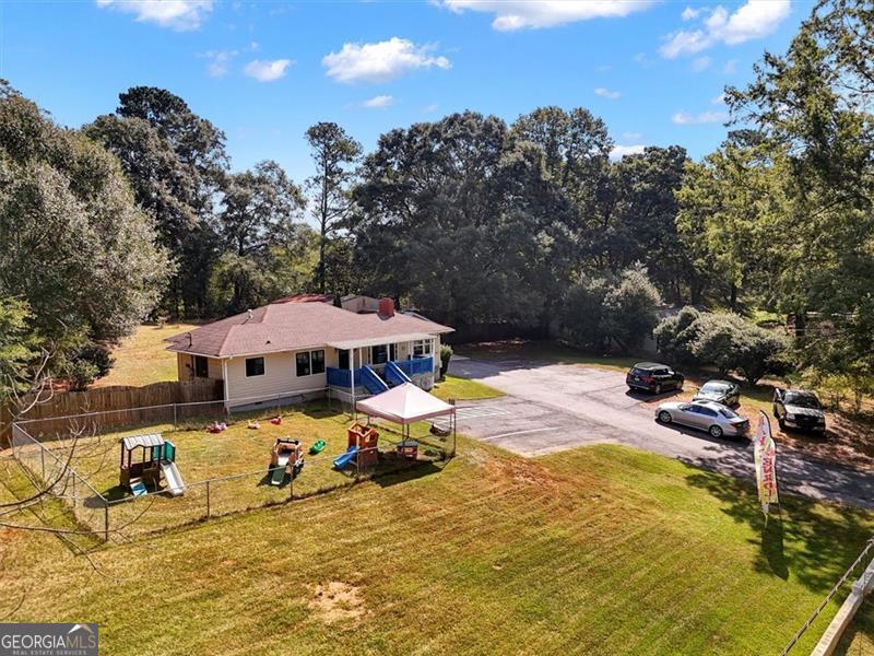 5099 Austell Powder Springs Road Austell, GA 30106 - Photo 2 of 38 an outdoor space with pool and furniture