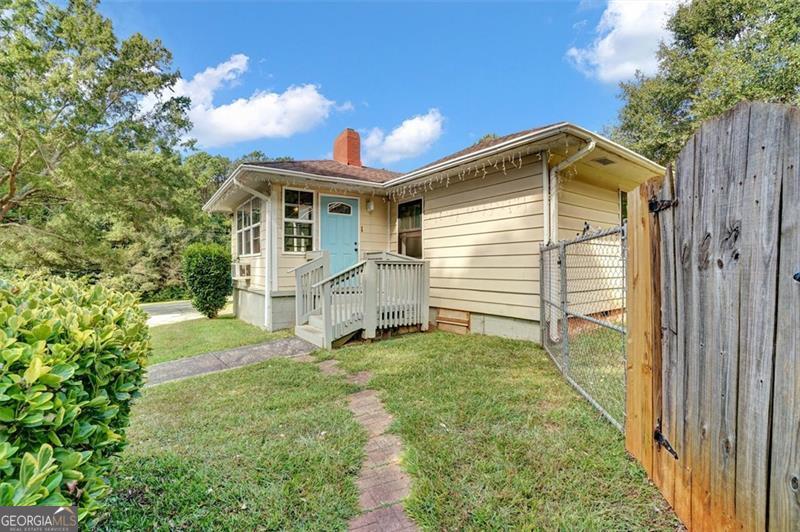 5099 Austell Powder Springs Road Austell, GA 30106 - Photo 27 of 38 a view of a house with a yard