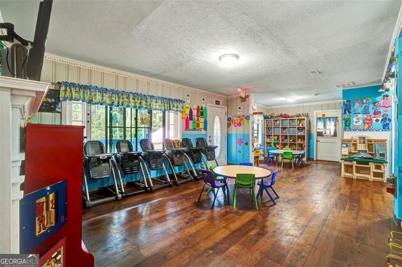 5099 Austell Powder Springs Road Austell, GA 30106 - Photo 6 of 38 a view of a dining room with furniture and wooden floor