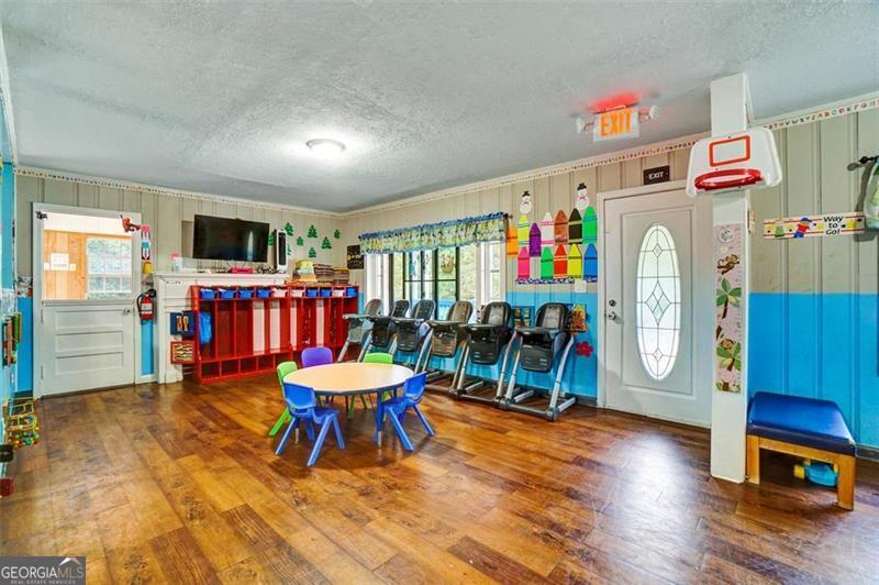 5099 Austell Powder Springs Road Austell, GA 30106 - Photo 7 of 38 a living room with furniture and a flat screen tv