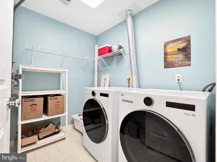 a view of livingroom with washer and dryer