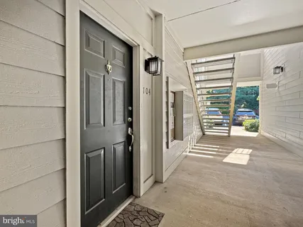 a view of a door and a window