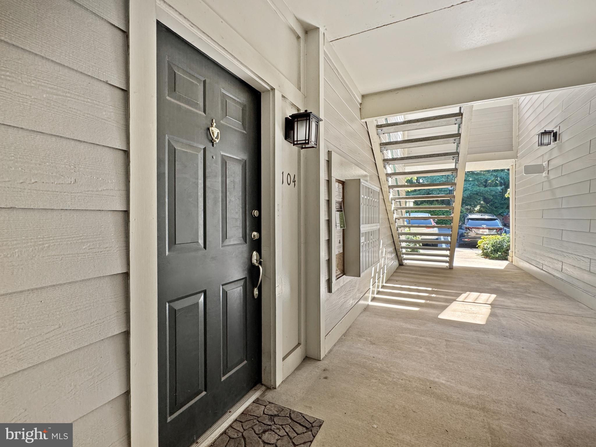 103 Timberbrook Lane, Unit 104 Gaithersburg, MD 20878 - Photo 2 of 35 a view of a door and a window