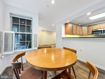 a view of a dining room with furniture and window