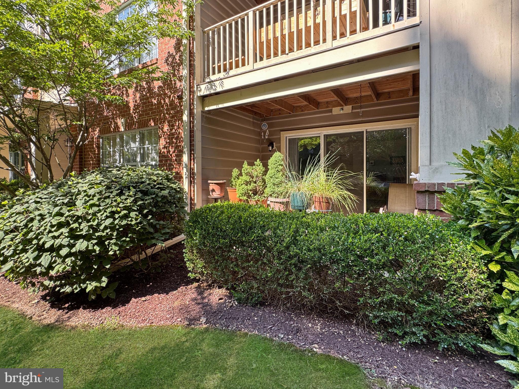 103 Timberbrook Lane, Unit 104 Gaithersburg, MD 20878 - Photo 26 of 35 front view of a house with a yard
