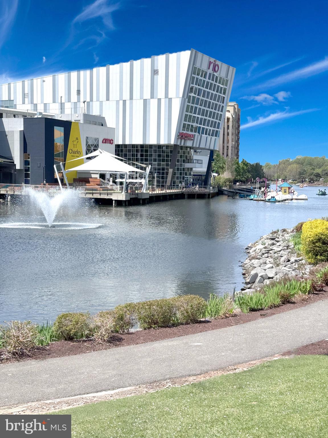 103 Timberbrook Lane, Unit 104 Gaithersburg, MD 20878 - Photo 30 of 35 a view of a lake with a car parked from a terrace
