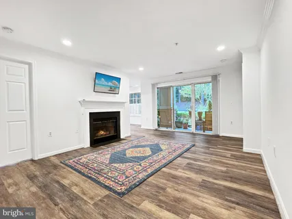 a view of a livingroom with an empty space and a fireplace