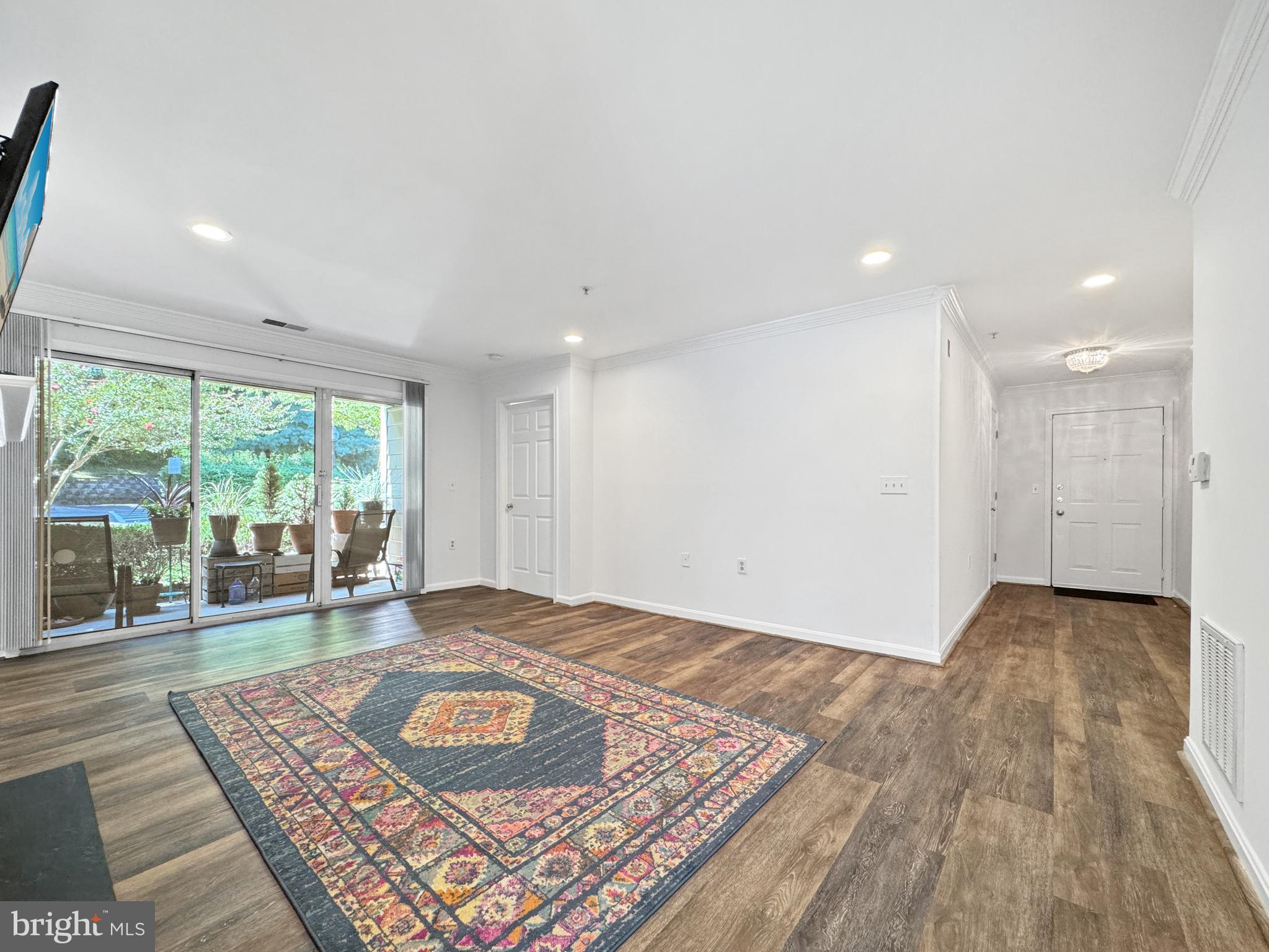 103 Timberbrook Lane, Unit 104 Gaithersburg, MD 20878 - Photo 7 of 35 a view of an empty room and window