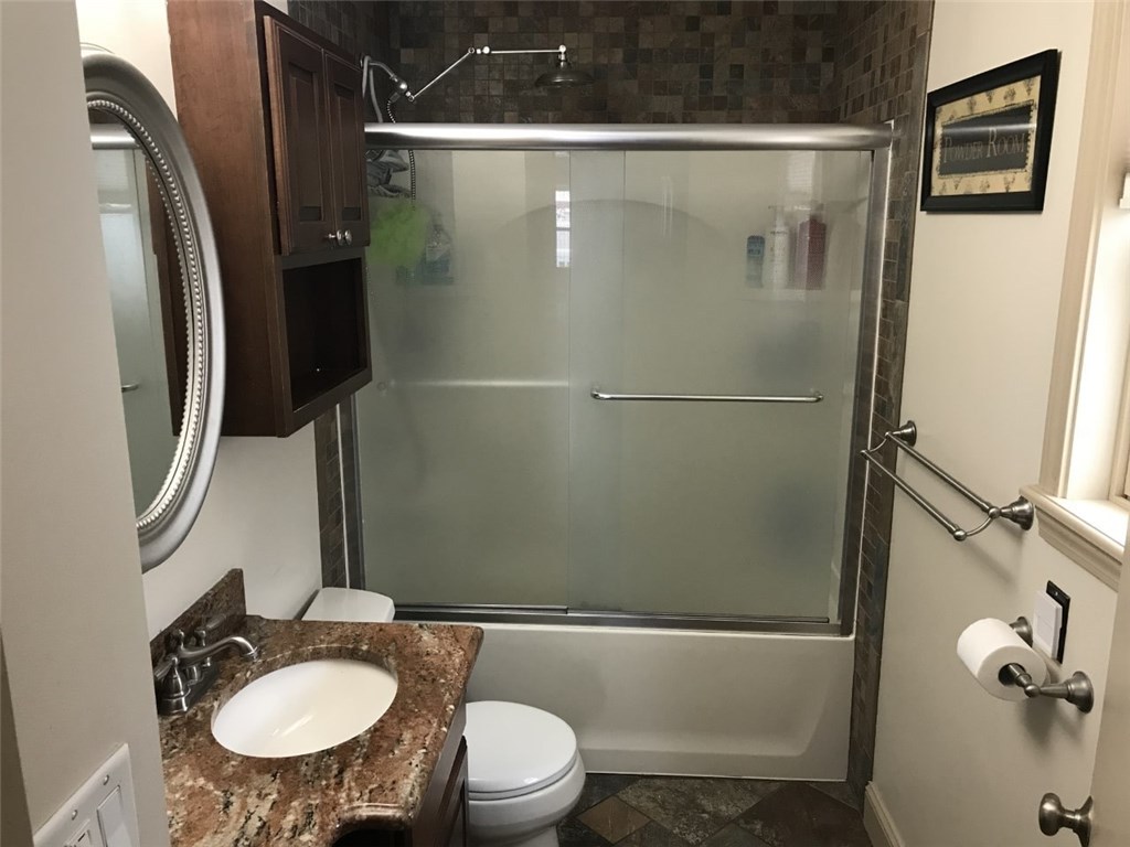28 Yolande Place Woonsocket, RI 02895 - Photo 17 of 31 First Floor full bath renovated