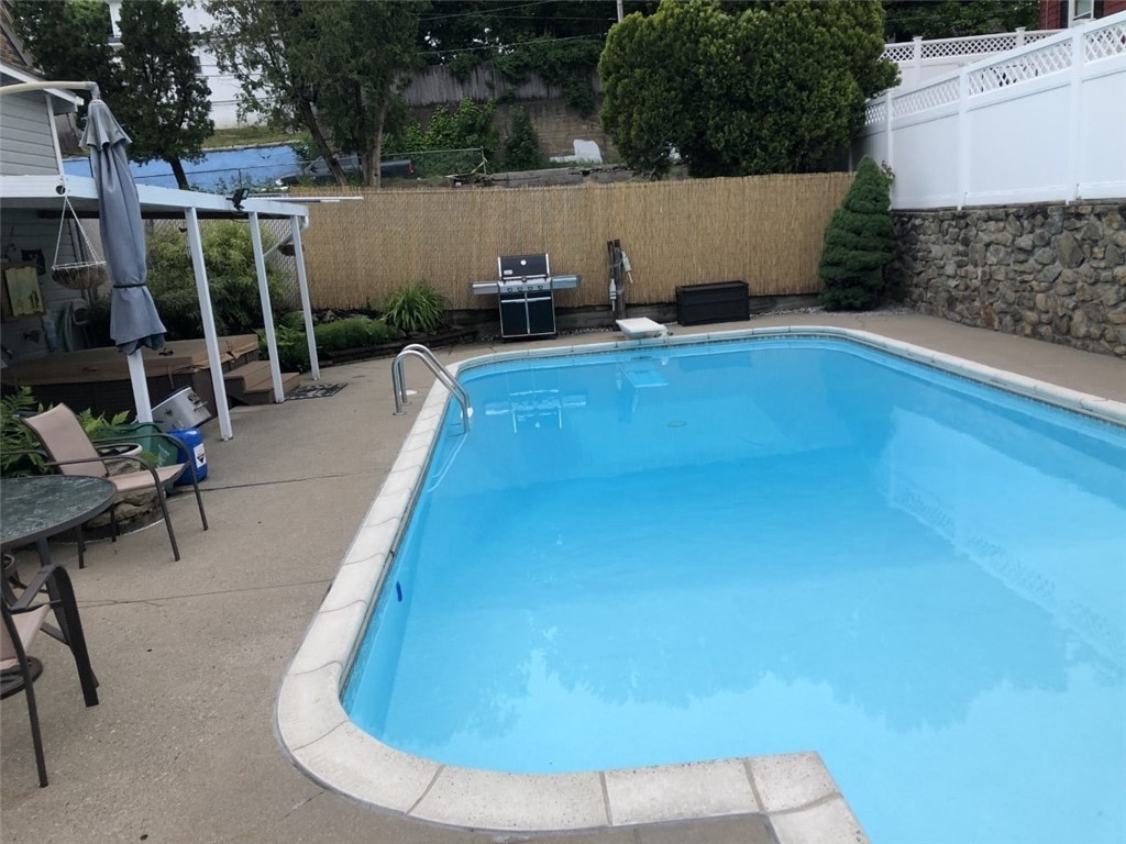 28 Yolande Place Woonsocket, RI 02895 - Photo 31 of 31 Inground pool w/diving board, fully fenced (double fenced yard), hot tub also.