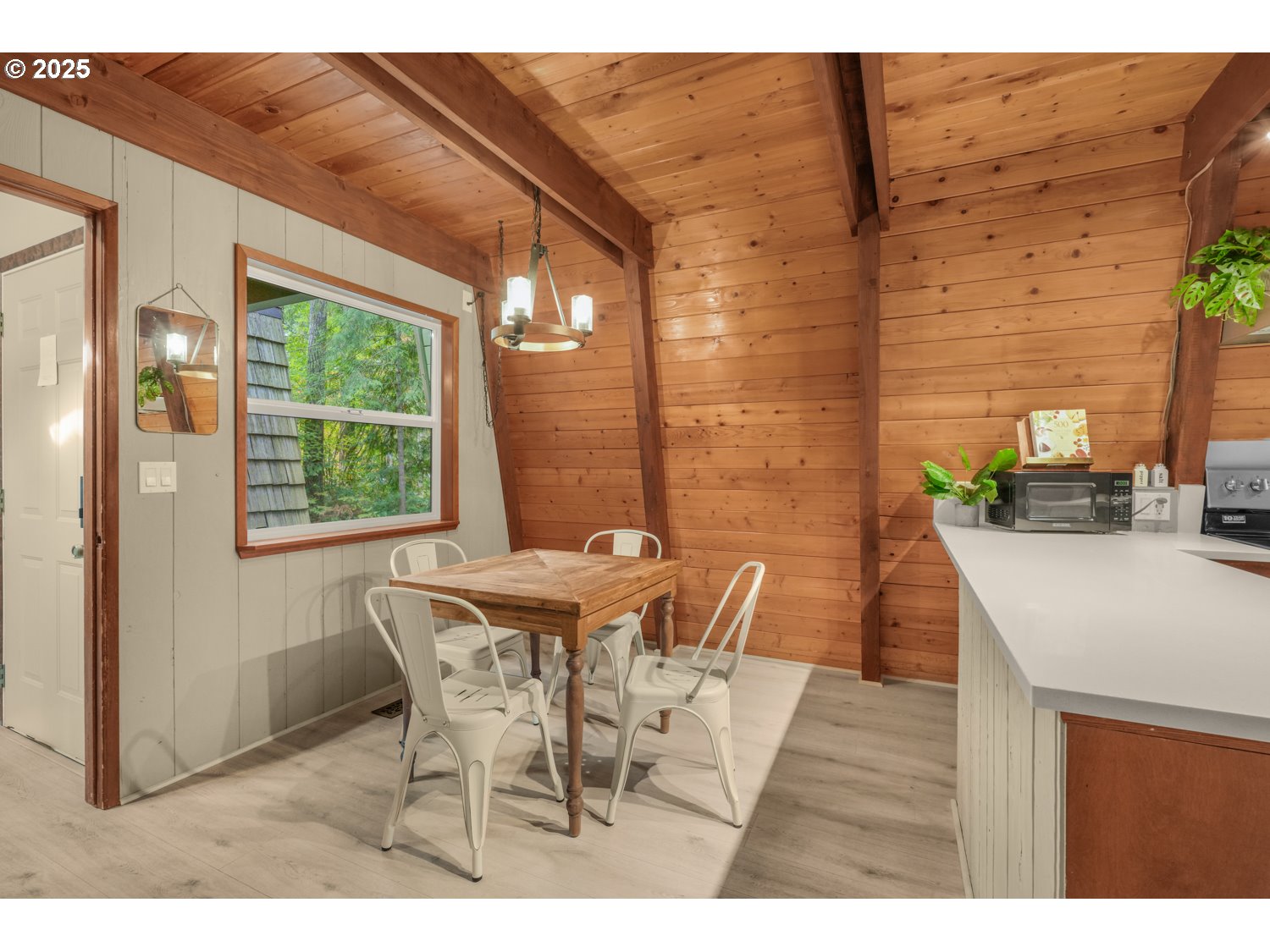 21760 East Tree Swallow Lane Rhododendron, OR 97049 - Photo 24 of 32 a view of a dining room with furniture and a window
