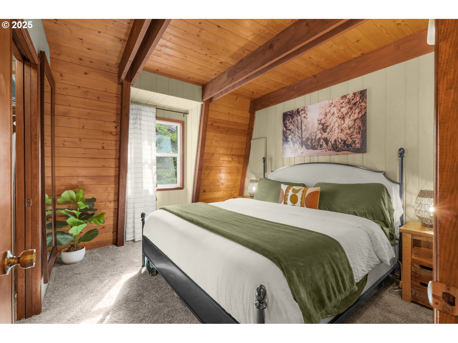 21760 East Tree Swallow Lane Rhododendron, OR 97049 - Photo 25 of 32 a bedroom with a bed and a painting on the wall