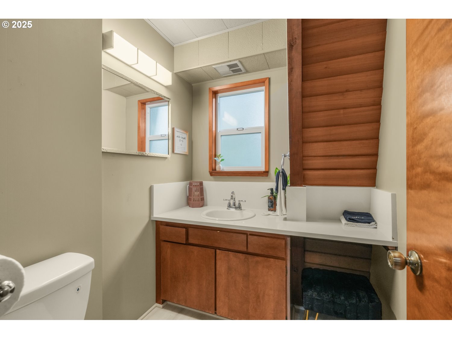 21760 East Tree Swallow Lane Rhododendron, OR 97049 - Photo 28 of 32 a bathroom with a sink and a mirror