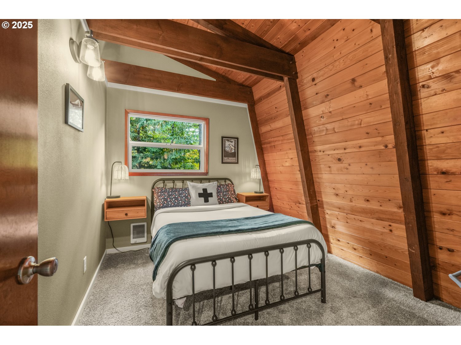 21760 East Tree Swallow Lane Rhododendron, OR 97049 - Photo 30 of 32 a bedroom with a bed window and a table