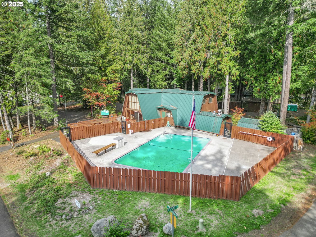 21760 East Tree Swallow Lane Rhododendron, OR 97049 - Photo 3 of 32 a view of a backyard with sitting area and slide