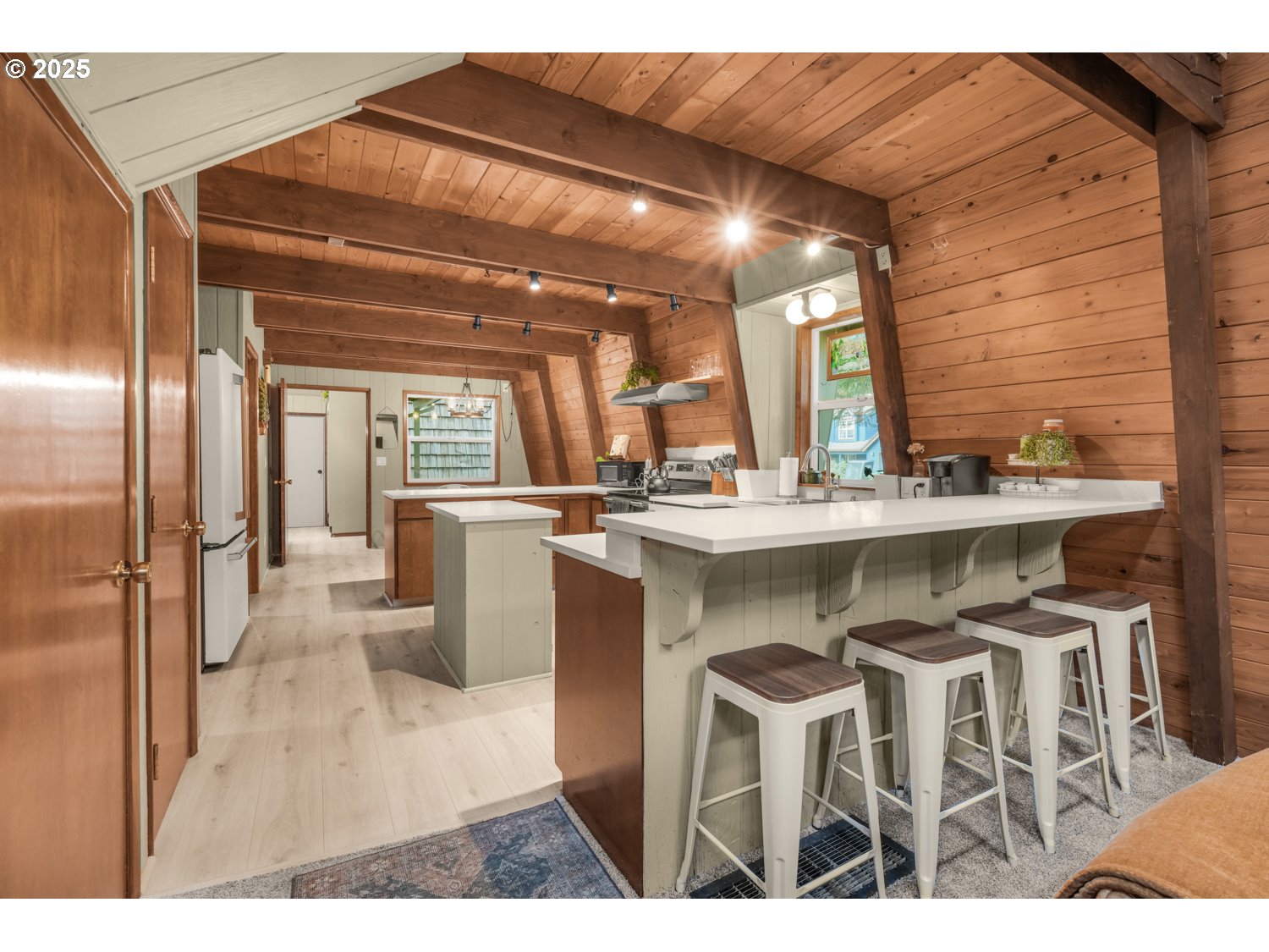 21760 East Tree Swallow Lane Rhododendron, OR 97049 - Photo 7 of 32 a kitchen with a sink cabinets and stainless steel appliances