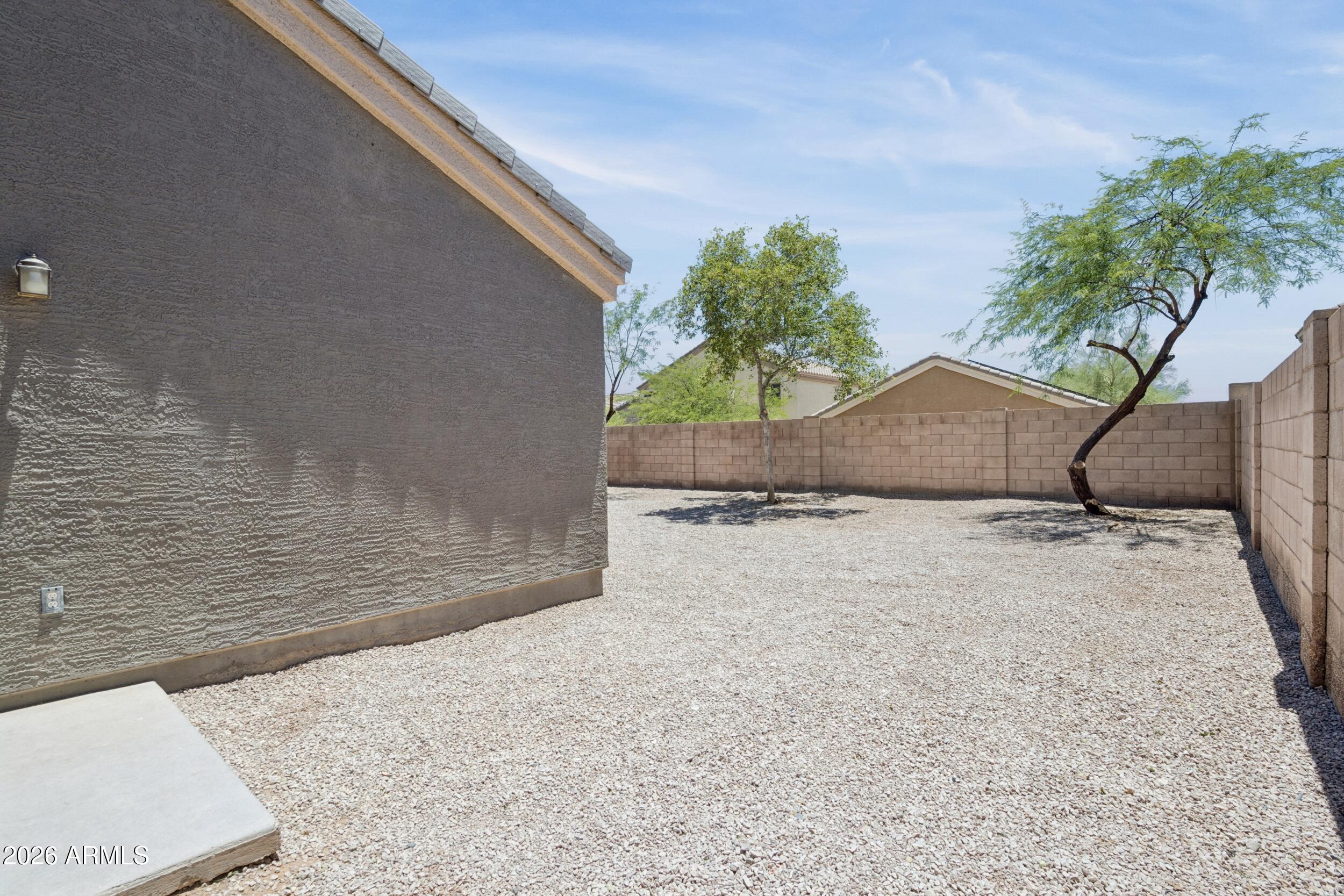 24025 West Pecan Road Buckeye, AZ 85326 - Photo 39 of 42 Side Yard by Porch