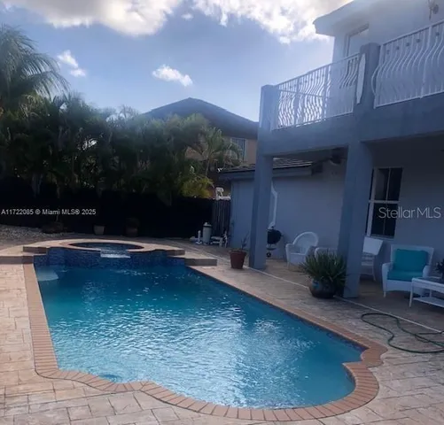 a view of a swimming pool with an outdoor space