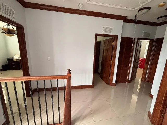 a view of a porch with wooden floor and stairs