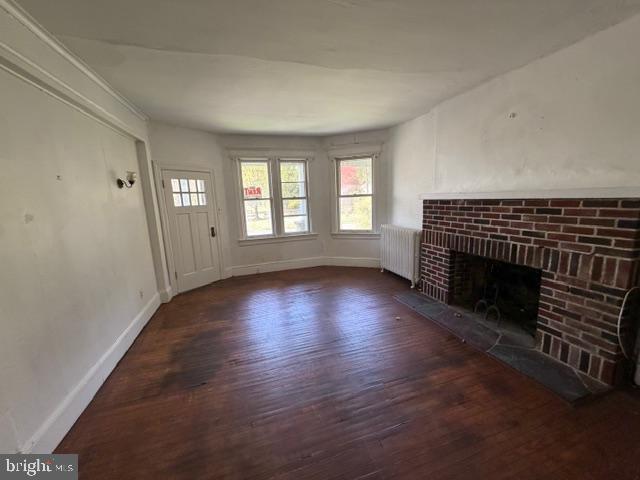 718 Woodlane Road Beverly, NJ 08010 - Photo 12 of 22 an empty room with wooden floor and windows