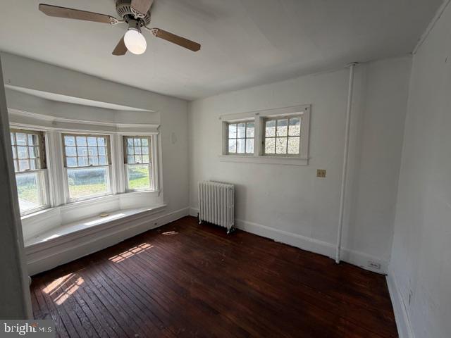 718 Woodlane Road Beverly, NJ 08010 - Photo 13 of 22 a view of an empty room with wooden floor and a window
