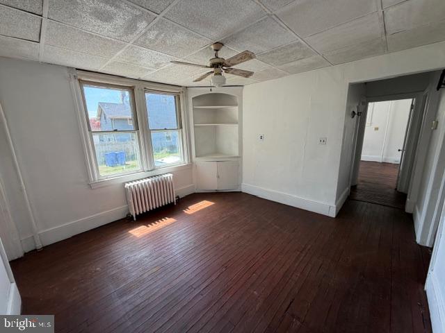 718 Woodlane Road Beverly, NJ 08010 - Photo 16 of 22 an empty room with wooden floor and windows