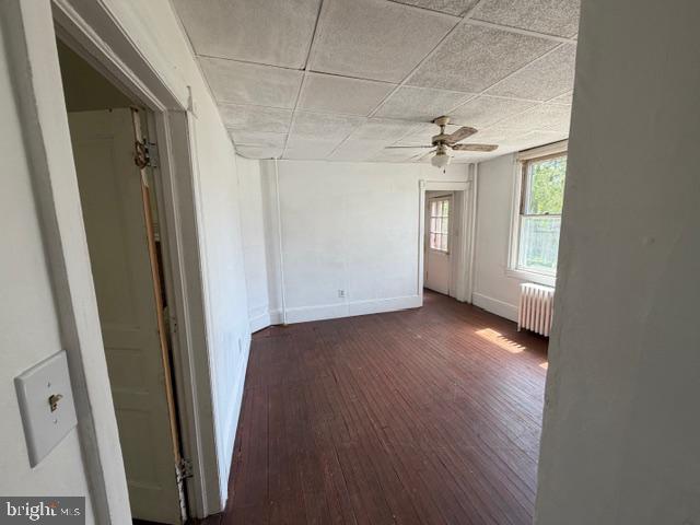 718 Woodlane Road Beverly, NJ 08010 - Photo 22 of 22 an empty room with windows and a ceiling fan