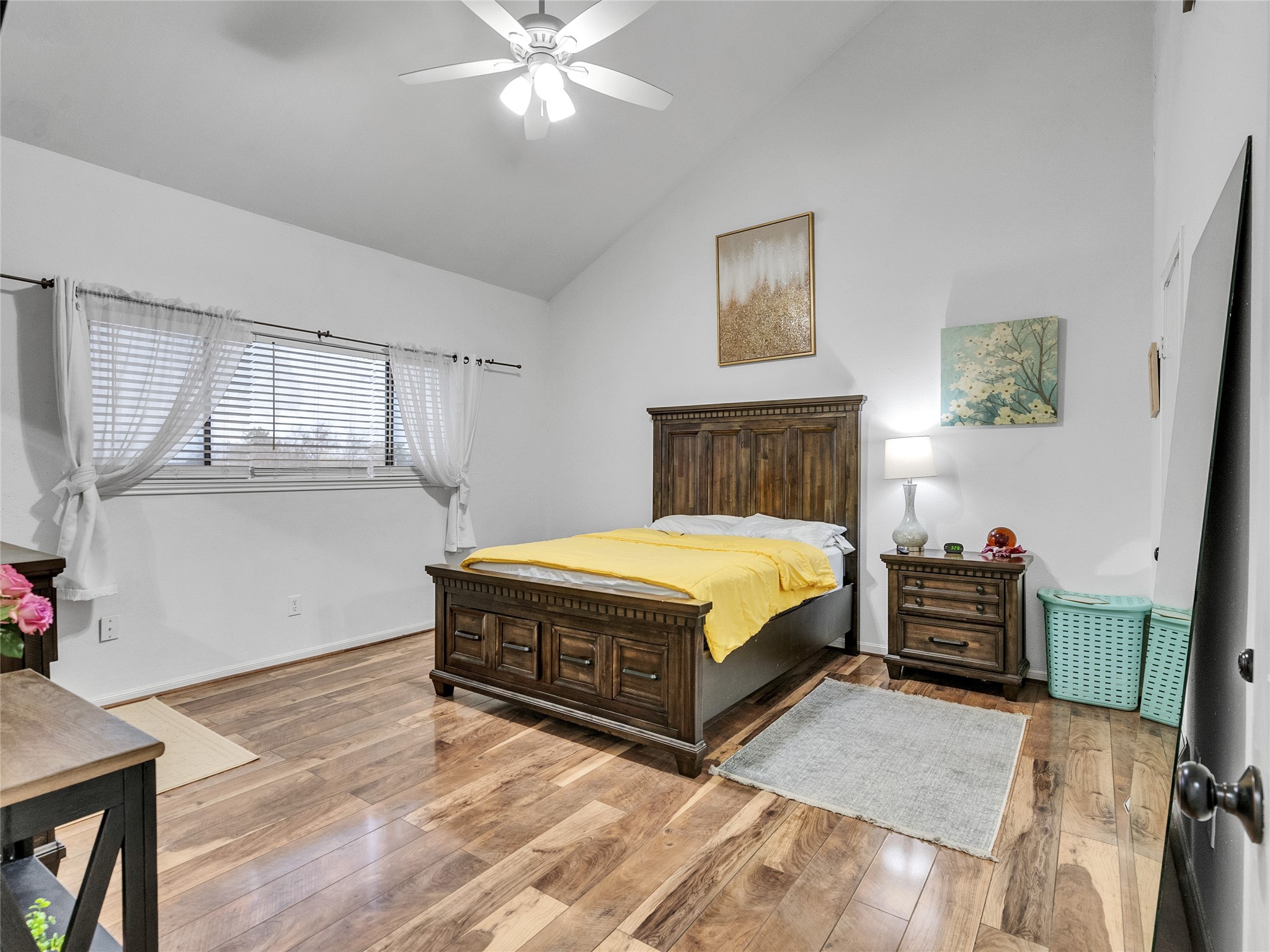 174 April Point Drive South Conroe, TX 77356 - Photo 21 of 38 a spacious bedroom with a bed and a chandelier